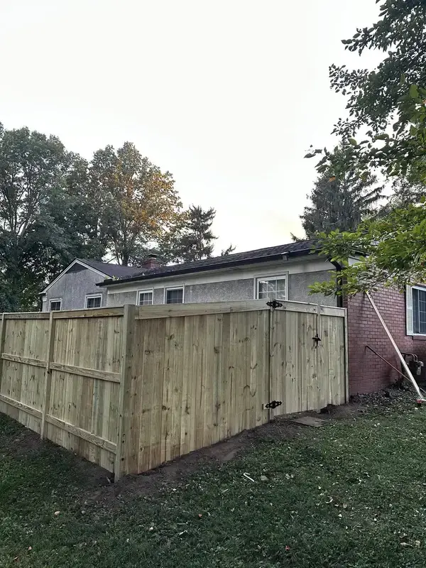Wood privacy fence with gate installed by Iron Edge in Columbus OH